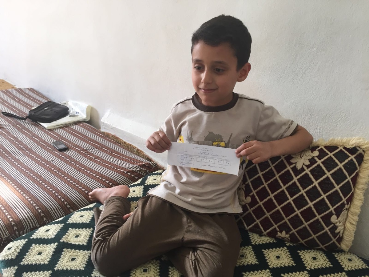 Mohammed with his report card